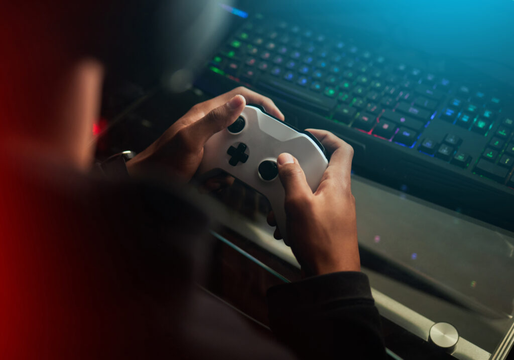 gaming-controller-hands-playing-games-online-streaming-with-gamer-competition-esports-video-game-tech-streamer-person-dark-room-play-tournament-with-joystick-keyboard (1)