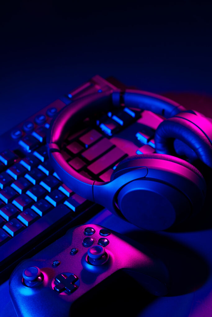headphones-joystick-computer-keyboard-black-table