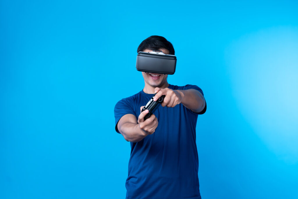 smart-gaming-player-wearing-vr-controlling-joystick-hologram-contrivance