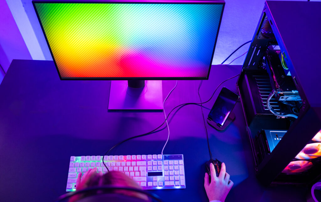 top-view-gamer-endeavor-plays-online-video-games-tournament-with-computer-neon-light-smiling-young-woman-wearing-gaming-headphones-intend-playing-live-stream-games-online-home